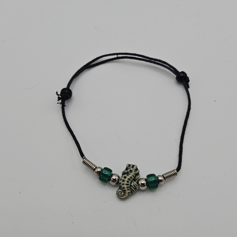 black slider bracelet with green and cream seahorse bead - Picture 1 of 3
